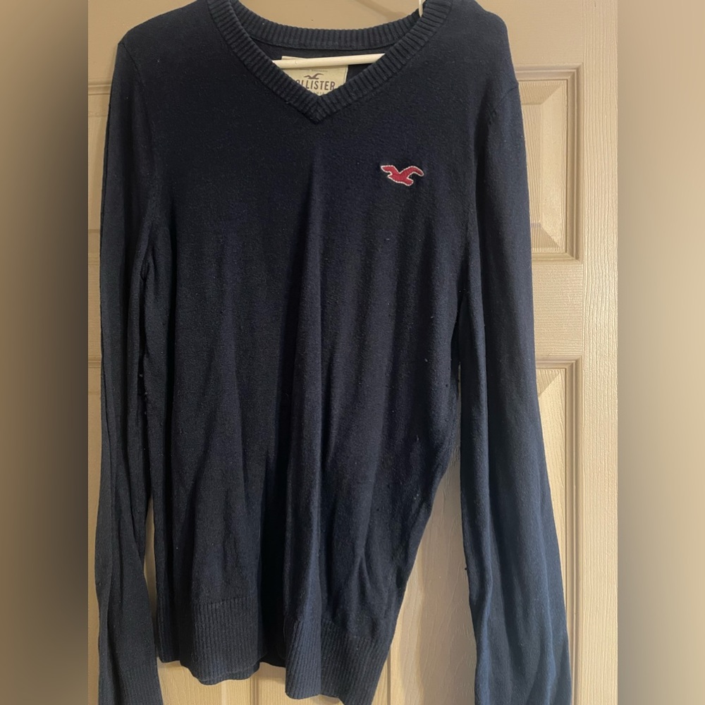 Blue Hollister size large V-neck sweater.